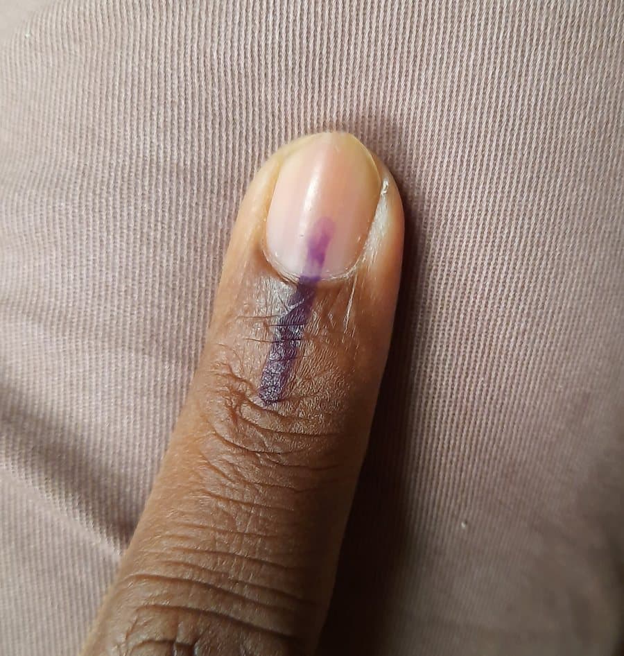 A voter's index finger marked with indelible election ink
